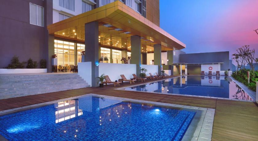 a large swimming pool in a hotel room, Aston Banua Banjarmasin Hotel & Convention Center in Banjarmasin