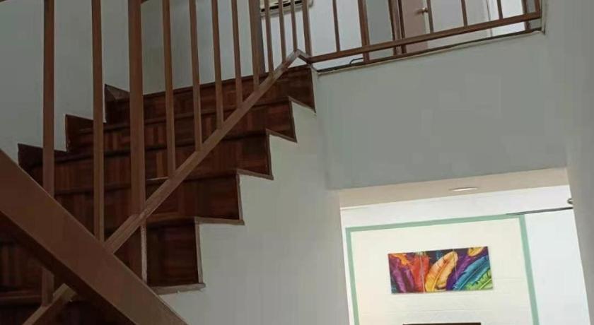 a staircase leading up to a living room, 12 to 16 Guests Homestay - Happy Home Taman Bukit Kempas in Johor Bahru