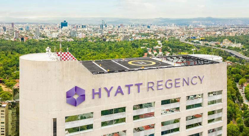 a large building with a clock on the side of it, Hyatt Regency Mexico City in Mexico City