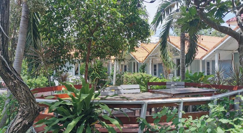 a patio area with tables, chairs and umbrellas, Barbados Terrace in Ko Samet