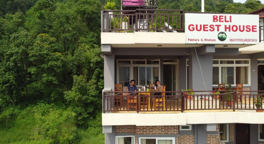 a house that has a boat on top of it, Beli Guest House in Pokhara