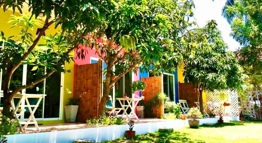 a house that has a tree in front of it, Namaste Resort in Prachuap Khiri Khan