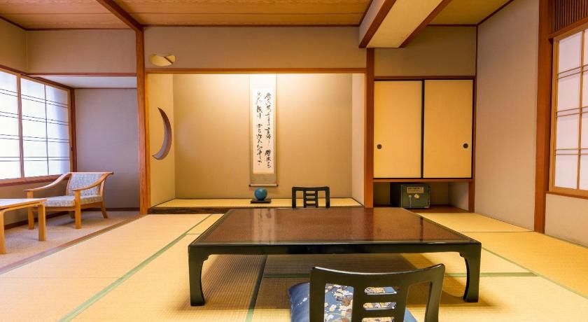 a living room with a table and chairs, Hakone Hotel Kajikaso in Hakone