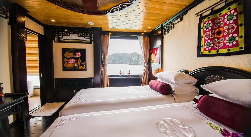 a bedroom with a bed and a window, Dragon Legend Cruise in Hạ Long