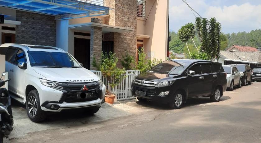 cars parked in front of a building, VILLA MB in Puncak