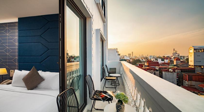 a hotel room with a view of the ocean, May De Ville Legend Hotel & Spa in Hanoi