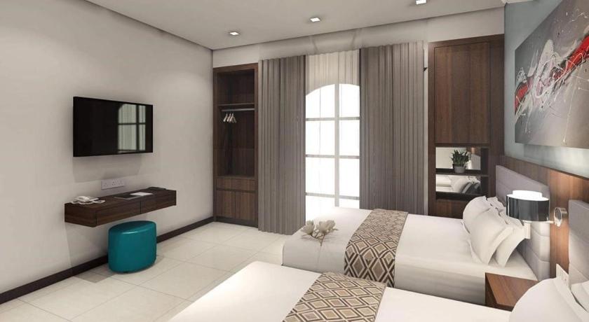 a hotel room with a large bed and a large window, Beryll Inn Cyberjaya in Kuala Lumpur
