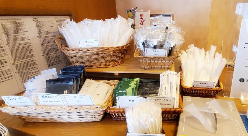 a wooden table topped with lots of different types of items, Island Hotel in Nagano