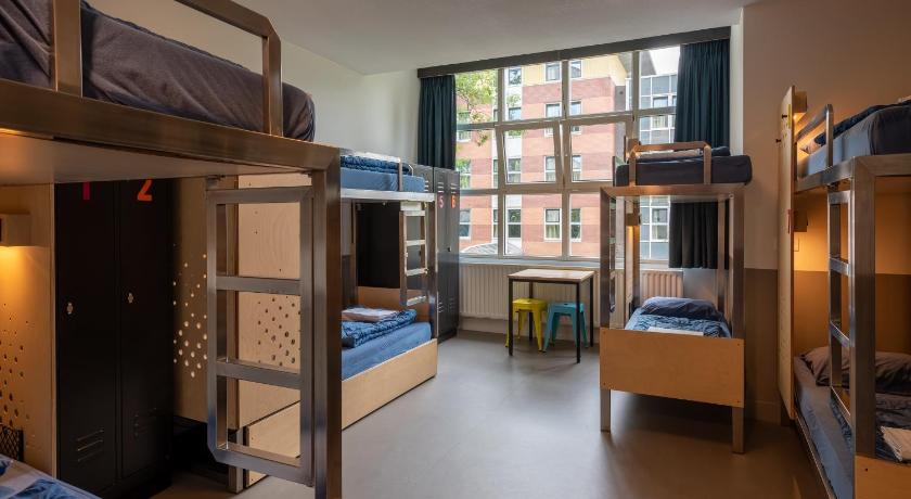 Image of Bed in 8-Bed Mixed Room with Shower 1