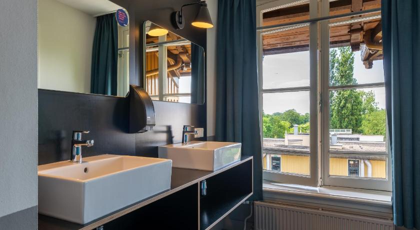 Image of Bed in 10+ Bed Mixed Room with Shower 2