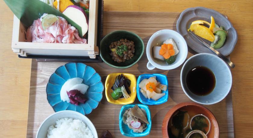 a table topped with plates of food and bowls of food, Daiwa Roynet Hotel Utsunomiya in Utsunomiya