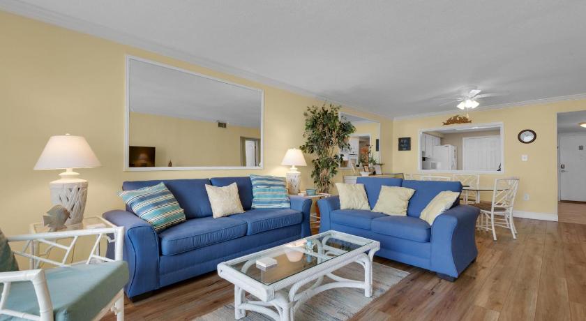 a living room filled with furniture and a couch, Shoreline Towers 1024 in Destin (FL)
