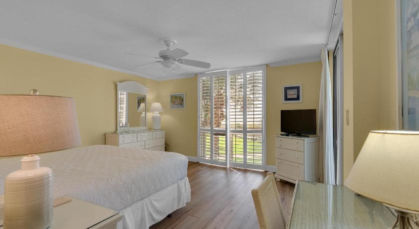 a bedroom with a large bed and a large window, Shoreline Towers 1024 in Destin (FL)