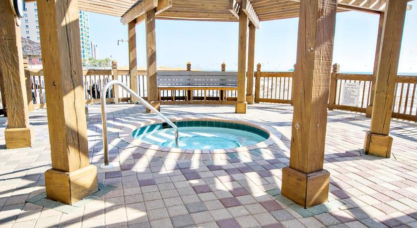 a pool with a pool table and chairs in it, Pelican Beach Resort 213 in Destin (FL)