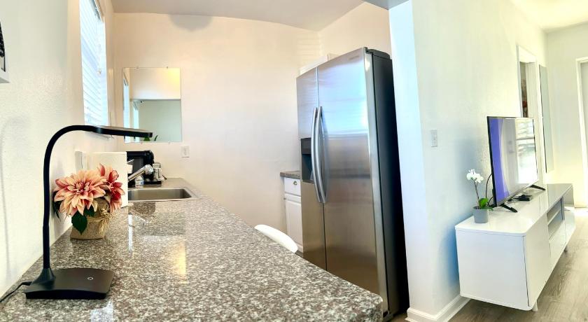 a kitchen with a sink, refrigerator, and dishwasher, A1A Ocean Club in Flagler Beach (FL)