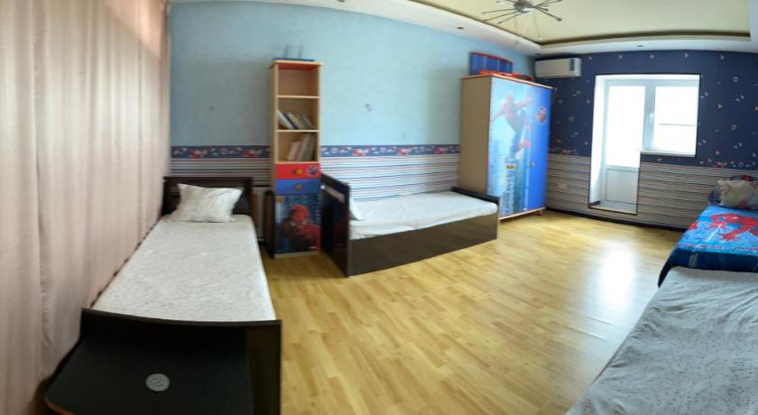 a bedroom with a bed and a desk, Роза ветров in Tashkent