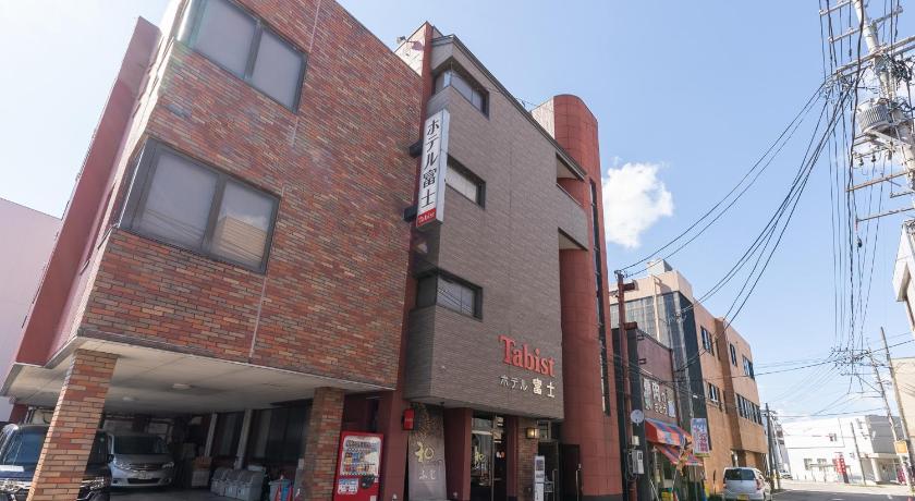 a brick building with a sign on the side of it, Tabist Hotel Fuji in Daisen-shi