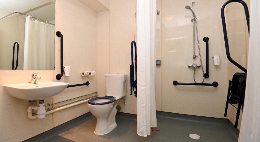a bathroom with a toilet, sink, and shower stall, Penny Hedge, Whitby by Marston's Inns in Whitby