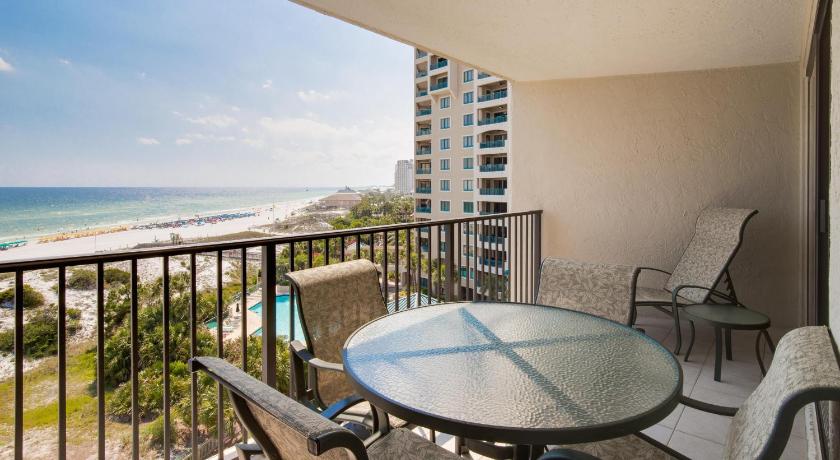 a patio area with chairs, tables, and a balcony, Beachside One 4073 flr7 2BR 2BA 6 in Destin (FL)