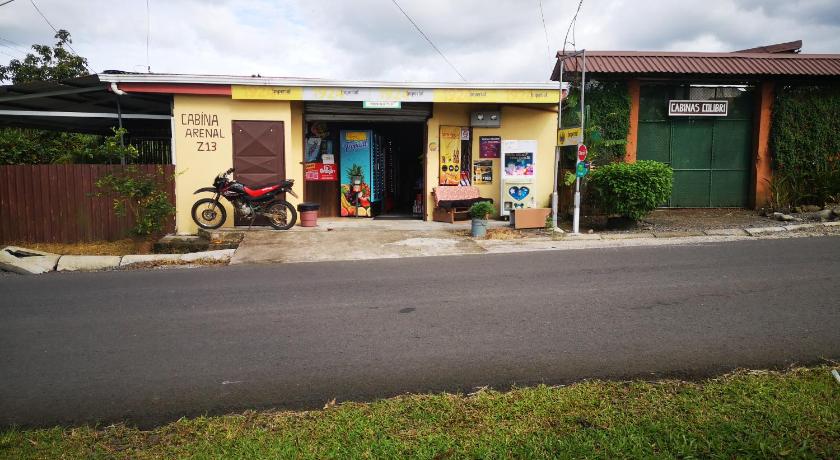 a small shop with a bicycle parked in front of it, Cabina Arenal Z13 in La Fortuna