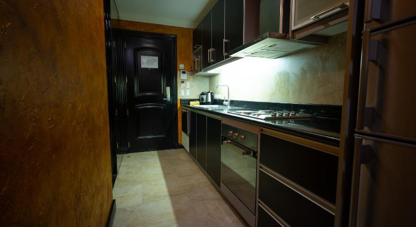a kitchen with a stove, oven and cabinets, Fields Plaza Condo in Angeles / Clark