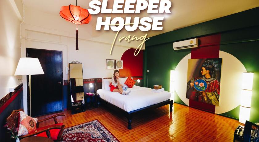 a hotel room with a bed and a television, Sleeper House in Trang