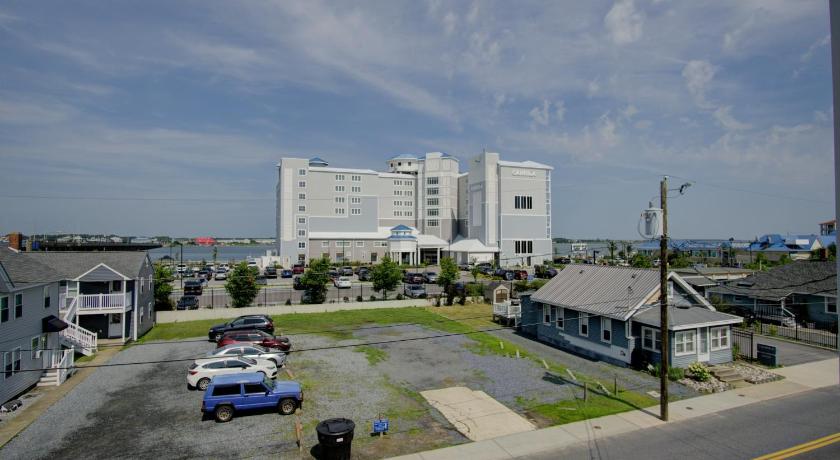a large white truck parked in front of a building, Dhimas Bayview Suites - New Building in Ocean City (MD)