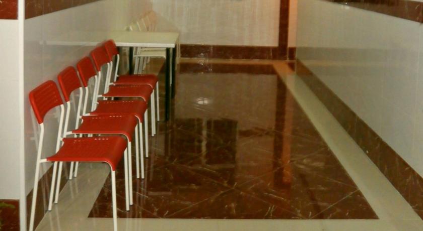 a row of red chairs sitting next to each other, Australia Lounge in Hong Kong