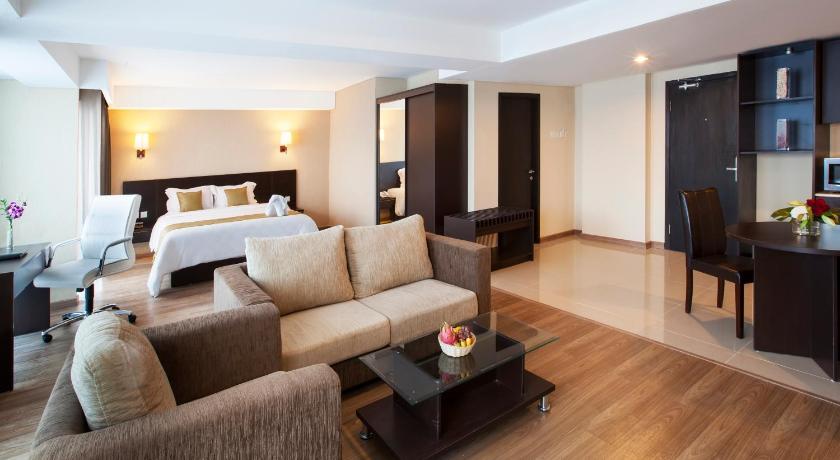 a living room filled with furniture and a fireplace, Best Western Premier The Hive in Jakarta