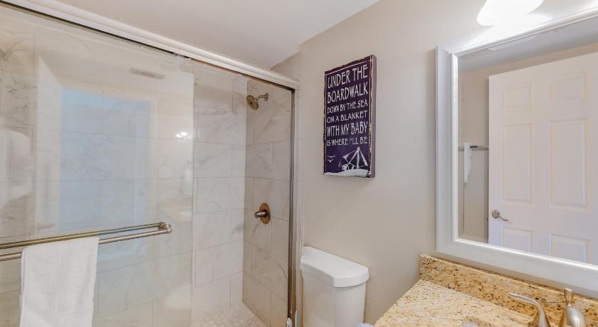 a white toilet sitting next to a bath tub in a bathroom, Huntington by the Sea 201 Miramar Beach (Condo) in Destin (FL)