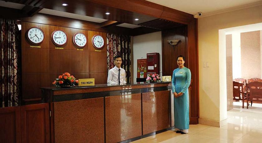 a woman standing next to a man in a kitchen, T78 Hotel in Ho Chi Minh City
