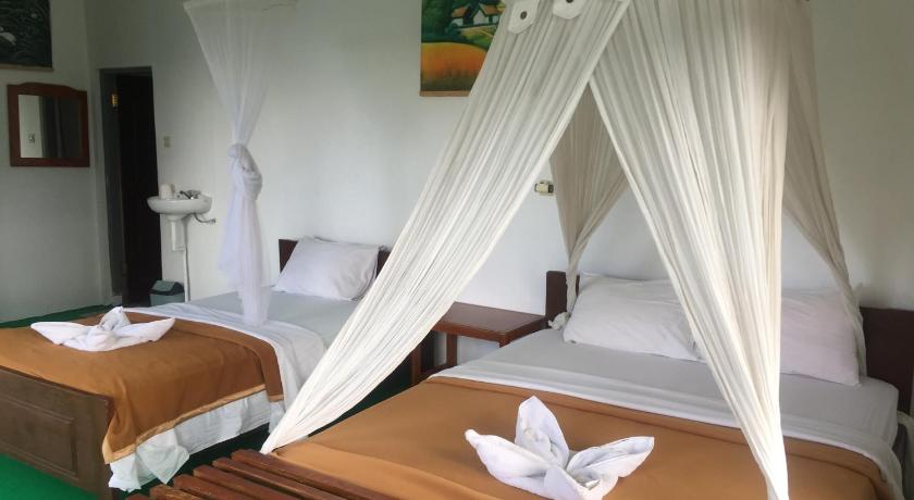 a bed room with a bed with a canopy on top of it, Bintang by Tobias Lodge Cafe & Restaurant in Ende