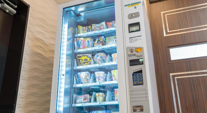 a refrigerator filled with lots of drinks and snacks, Hotel Koza in Okinawa Main island