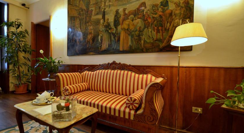 a living room filled with furniture and a painting, Hotel Roma e Rocca Cavour in Turin
