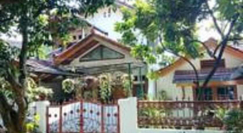a house with a fence and trees, Hostel Bogor (perlu bukti nikah) in Bogor
