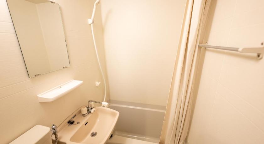 a bathroom with a sink, toilet and bathtub, Hotel EKICHIKA Nagahoribashi in Osaka