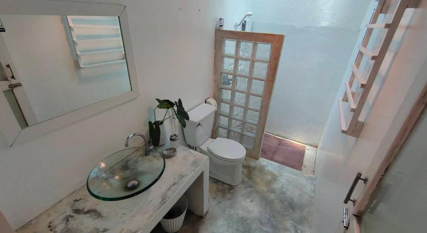 a bathroom with a sink and a toilet in it, Rain Forest Resort Phitsanulok in Phitsanulok