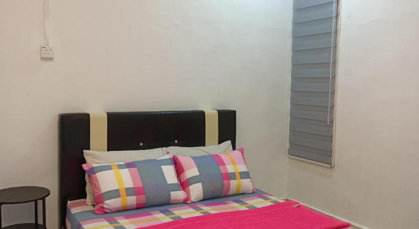 a bed room with a white bedspread and a blue comforter, ADAMAYRAA HOMESTAY Tanah Merah in Tanah Merah