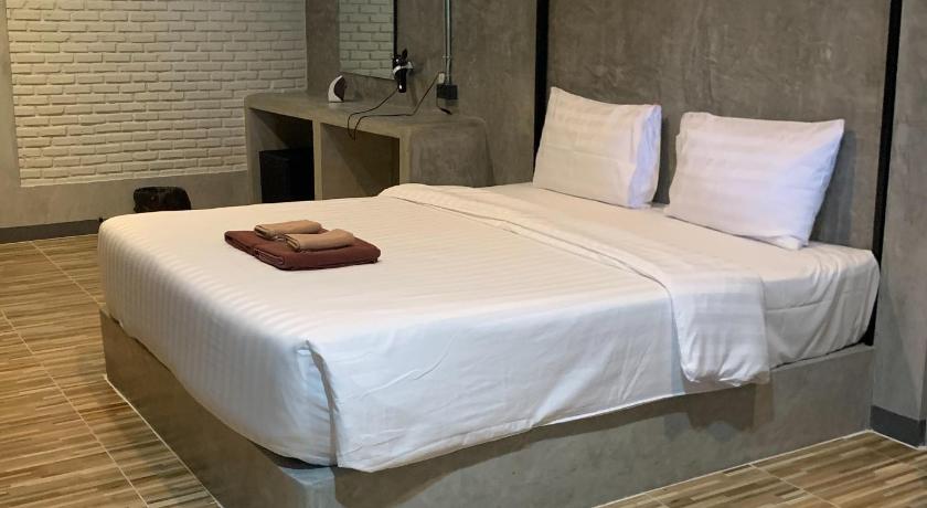 a hotel room with a bed and a desk, The Loft @Chiangrai in Chiang Rai