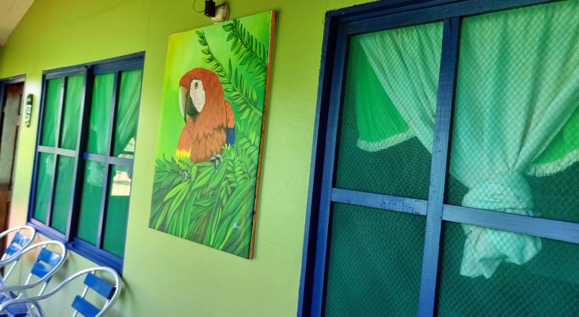a window with a picture of a cat on it, Cabinas Tortuguero Natural in Tortuguero