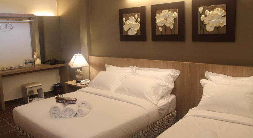 a hotel room with two beds and two lamps, Fomecs Boutique Hotel in Malacca