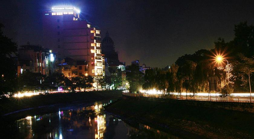 a city street at night with lights on, Riverside Hanoi Hotel in Hanoi