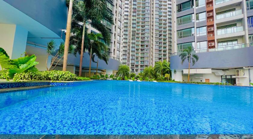 a swimming pool with a blue sky, R&F Princess Cove By Homefort Suites in Johor Bahru