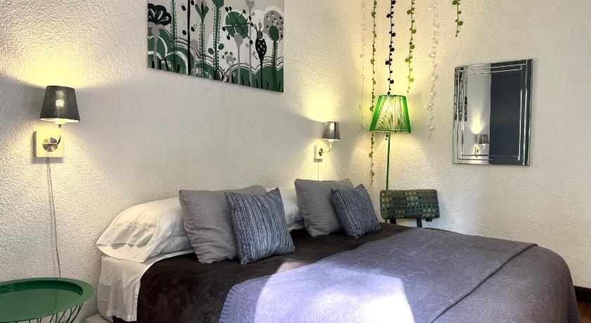 a bedroom with a bed and a lamp, Distrito Condesa Rooms and Studios in Mexico City