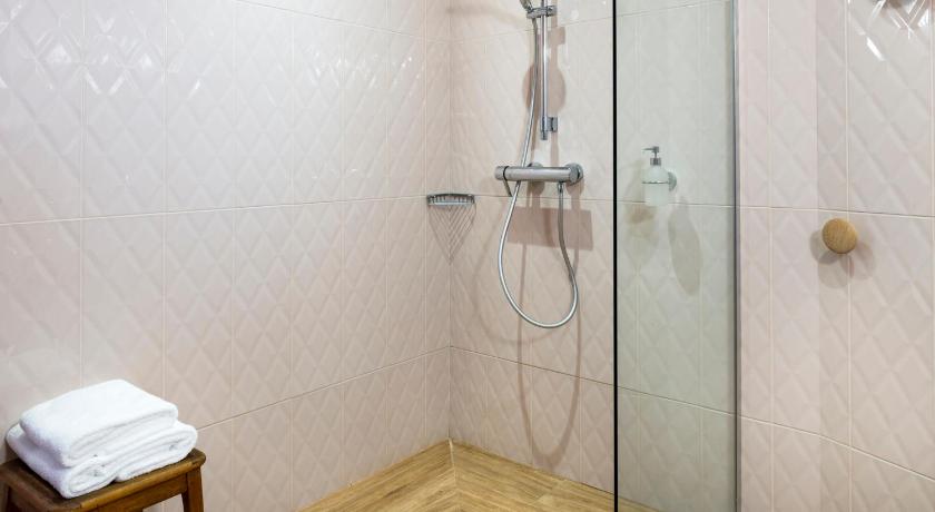 a bathroom with a shower, toilet, and sink, Hotel Boris V. by Happyculture in Paris