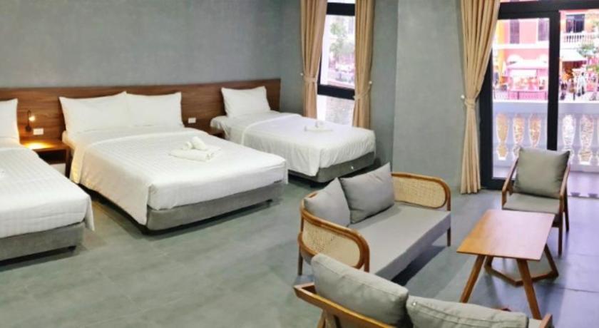 a hotel room with two beds and a television, HANZ VeniceRiver Power MIA Grand World in Phú Quốc Island