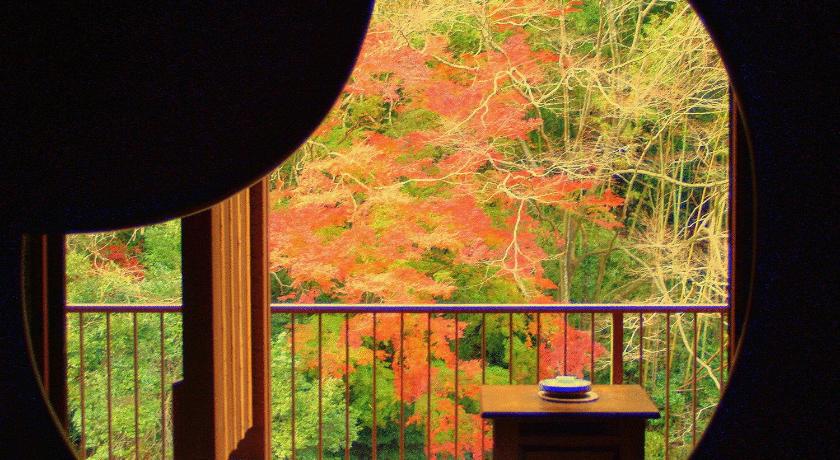 a wooden table in front of a window, Hakone Shiunso in Hakone