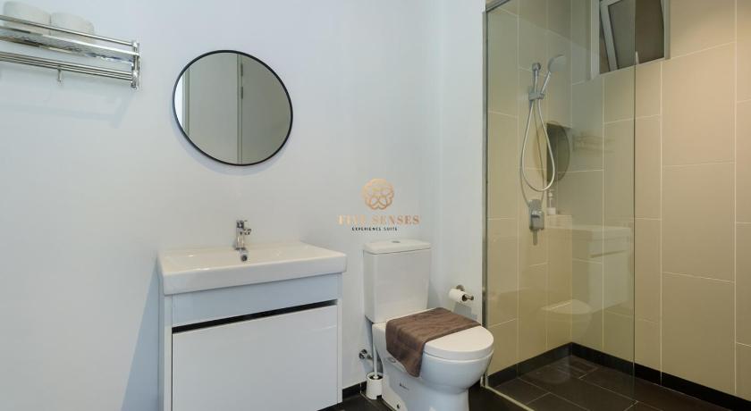 a white toilet sitting next to a bathroom sink, UNA Serviced Apartment, Sunway Velocity KL in Kuala Lumpur
