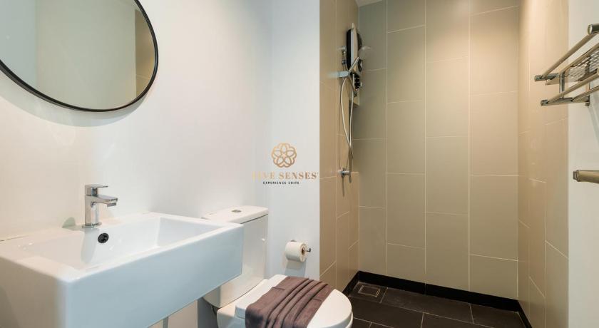 a bathroom with a toilet, sink, and shower, UNA Serviced Apartment, Sunway Velocity KL in Kuala Lumpur