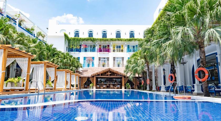 a large swimming pool in a hotel room, Risemount Premier Resort Danang in Da Nang